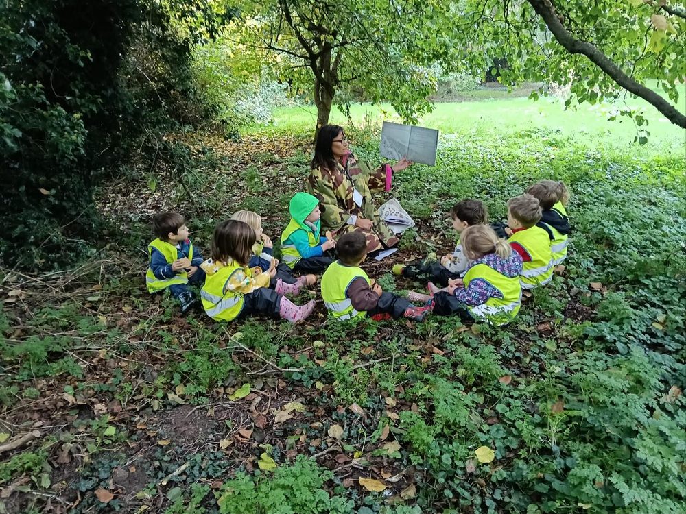 Children exploring the woodland at Clifton Upon Teme Nursery